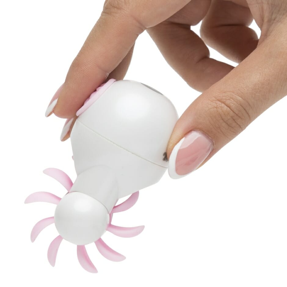 Sqweel Go Oral Sex Massager in white with pink