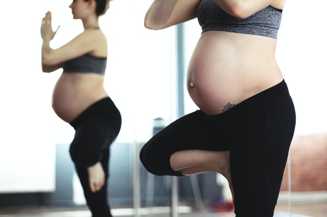 A pregnant woman doing yoga