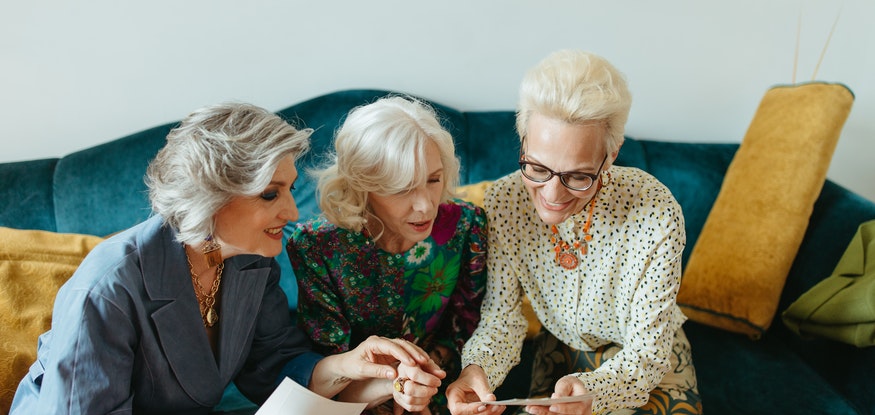three older women smiling