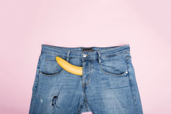 a pair of jeans with a banana in the zipper