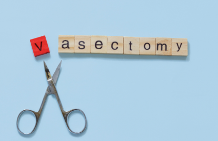 vasectomy spelled in scrabble letters with a scissors cutting of the v