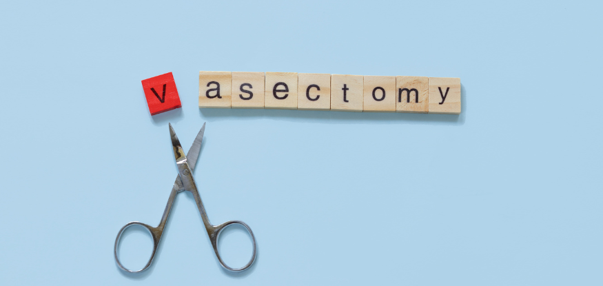 vasectomy spelled in scrabble letters with a scissors cutting of the v
